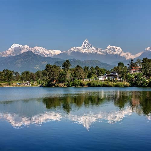 view-at-annapurna-mountain-range-and-its-reflection-in-phewa-lake-in-pokhara-nepal